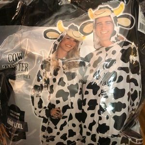 Two adult cow costumes